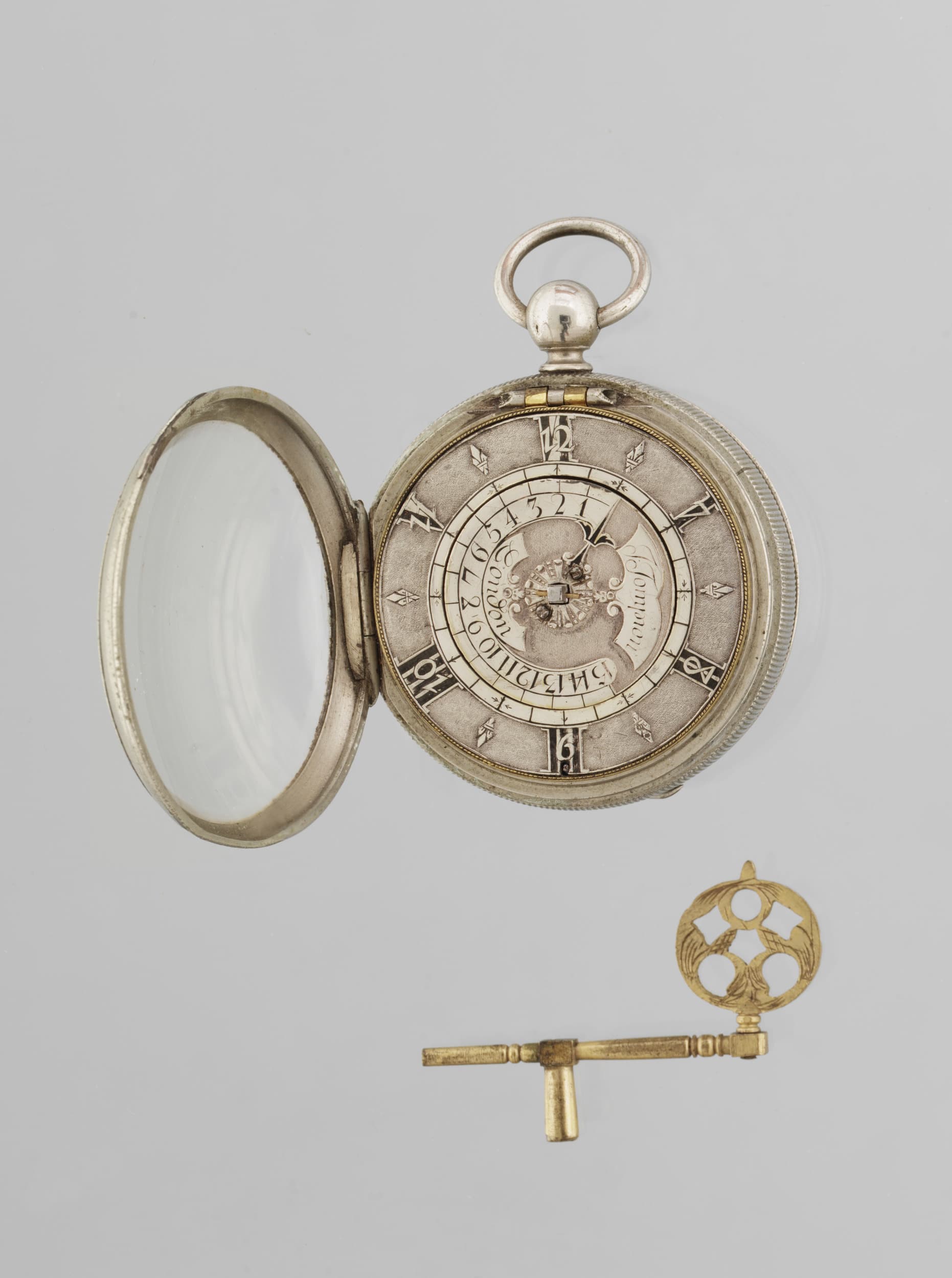 Round, silver pocket watch, opened