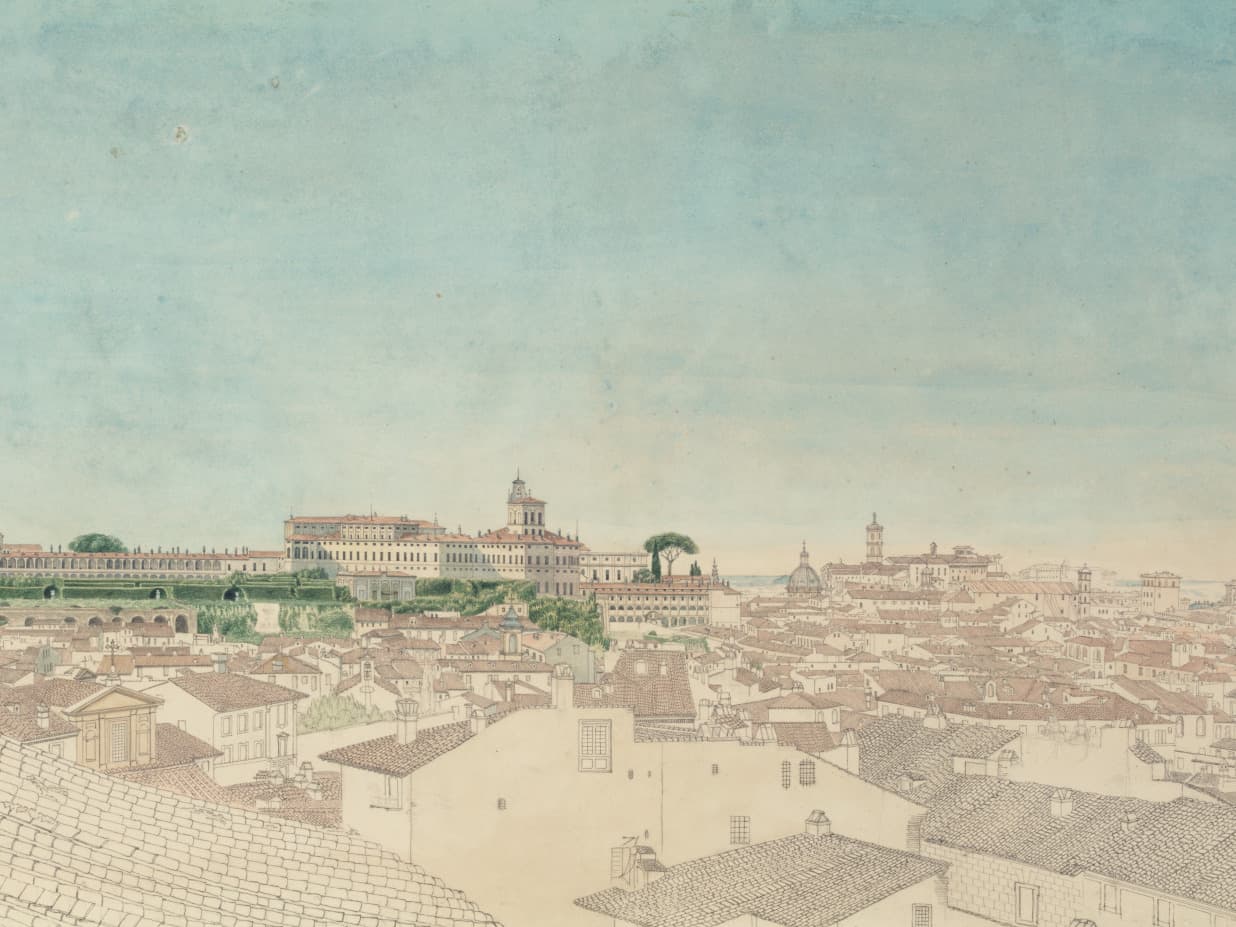 Ein Panoramablick auf eine historische Stadtlandschaft mit zahlreichen Dächern, Türmen in der Ferne und einem klaren blauen Himmel.