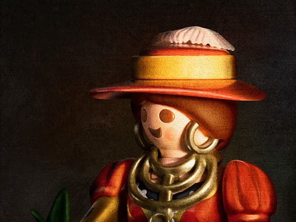 Toy figure in red attire with gold accessories, holding a green object, wearing a wide-brimmed hat, on a dark background.