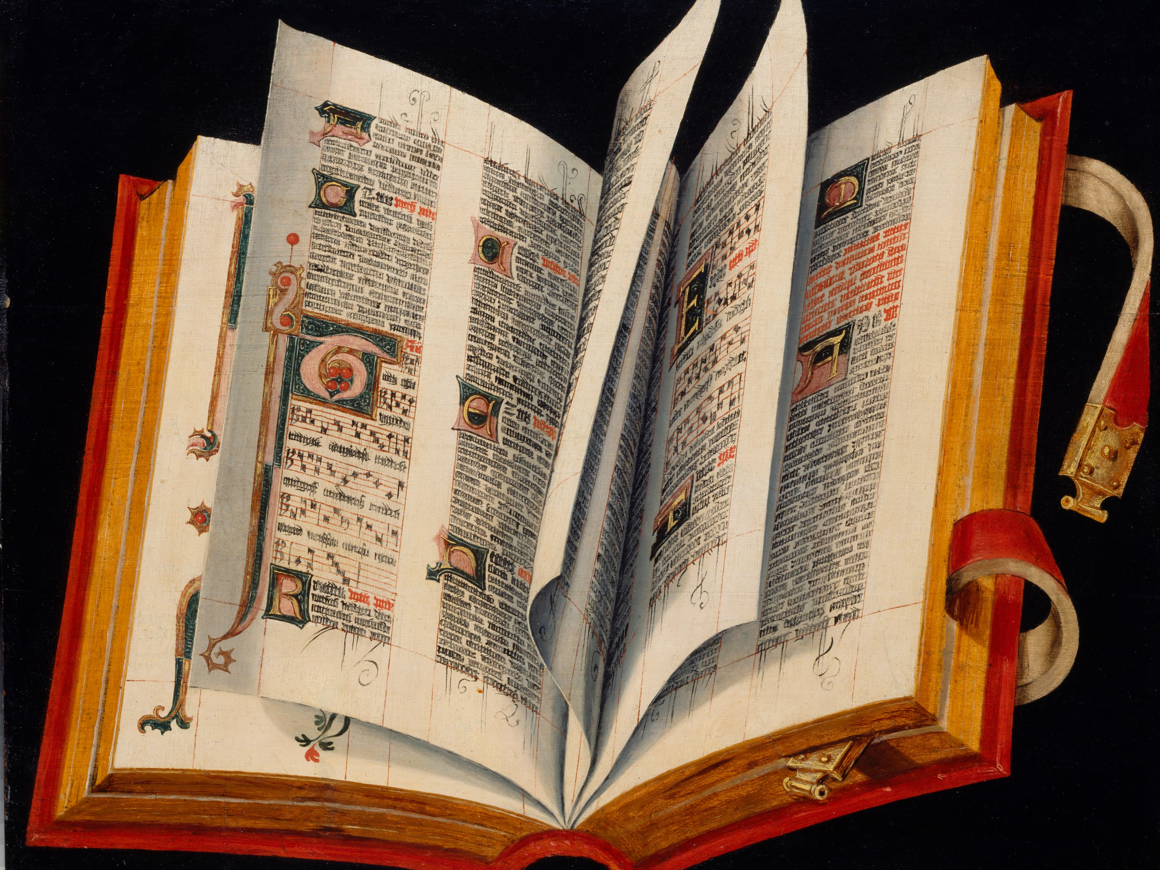 Ein offenes illuminiertes Manuskript mit kunstvoller Beschriftung und dekorativen Rändern, mit leuchtend roten und goldenen Akzenten auf den Seiten.